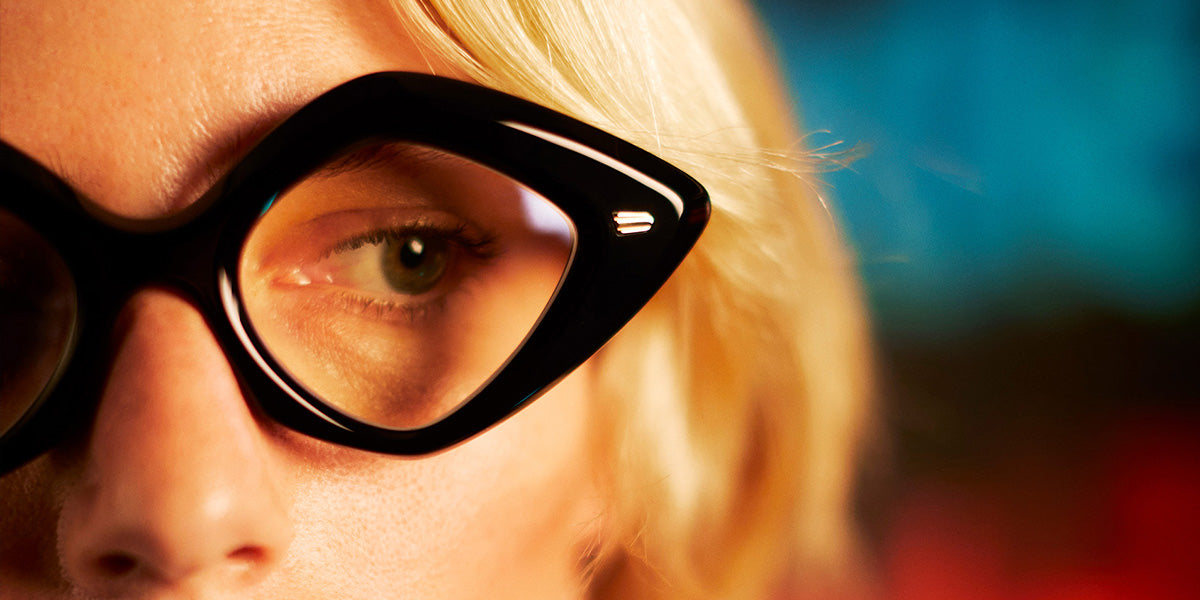 Cutler and Gross optical frame on blonde woman in sharp focus